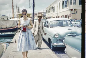 Tourist taking photographs in the fishing harbour, Willemstad, Curacao, Dutch Caribbean, early 1960s, South America