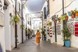 A tourist in the white houses walking in the municipality of Mijas in Malaga