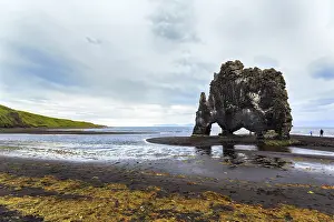 Tourists at the basalt rock Hvitserkur