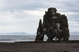 Tourists, couple at the basalt rock Hvitserkur