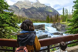 Tourists are enjoying the breathtaking view of athabasca falls