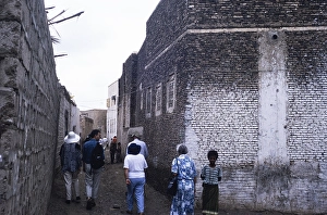 Tourists explore the ancient city of Zebid, Zabid, Yemen 1998 UNESCO World Heritage Site