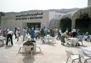 Tourists of a Hellenic tour group in front of a hotel and a service area in Petra, Jordan, 1998, Asia