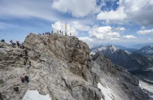 Tourists queue up for the summit of the Zugspitze