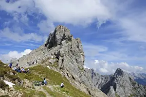 Tourists in front of the summit of Mt Westliche Karwendelspitze