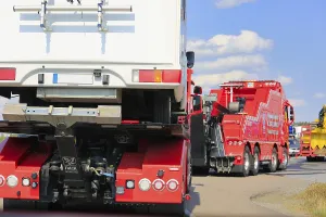Tow truck carrying a camper van in truck convoy to Power Truck Show 2018 with other recovery vehicles