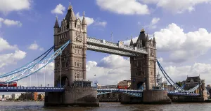 Tower Bridge over River Thames against a backdrop of cloudy sky during daytime in the City of London