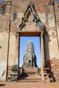 Tower seen through a gate temple Wat Ratburana Ayutthaya Thailand