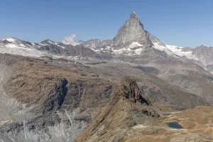 The towering peak of the Matterhorn dominates the clear sky