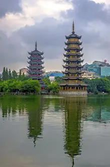 Two towers, pagodas of Sun and Moon by the lake