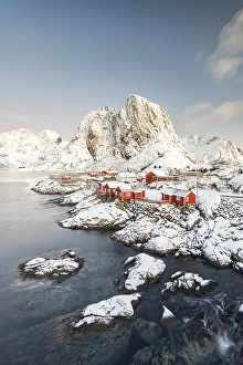 Category Scandinavia Prints: Town and fisherman's cabins or Rorbus in front of snowy mountains