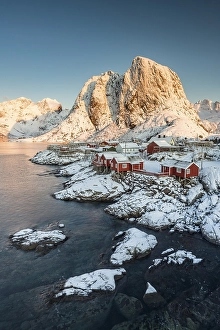 Category Scandinavia Prints: Town and fisherman's cabins or Rorbus in front of snowy mountains