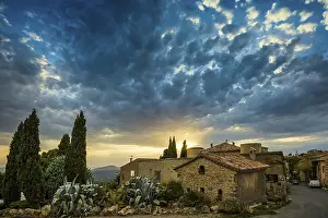 Town at sunset with cloudy skies