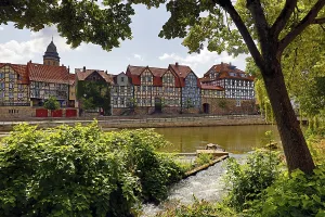 Town view with half-timbered houses and the river Fulda