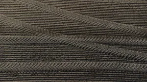 Tractor tyre tracks form an interesting pattern on a freshly cultivated field without vegetation