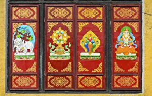 Traditional Buddhist motifs on wall