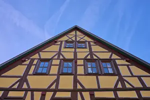 Traditional half-timbered house under clear blue sky