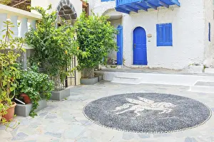 Traditional pebble mosaic adorning Mandraki old town