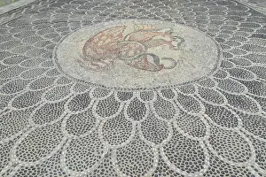 Traditional pebble mosaic adorning Mandraki old town