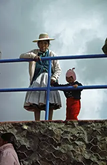 Traditionally dressed young woman with infant