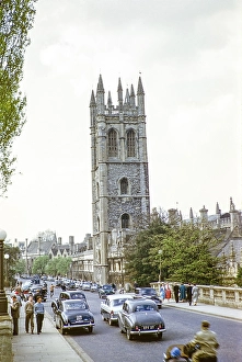 Traffic over Magdalen Bridge and past Magdalen Tower, Oxford, Oxfordshire, England, UK, 1956 Wolsely 4/44, Austin A 40 cars