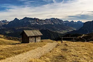Trail with alpine hut and South Tyrolean mountains