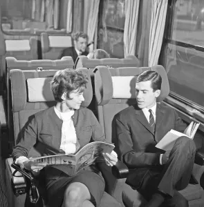 Train travel in the 1960s. A couple on a train