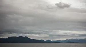 Framed Print : A tranquil seascape with mountains