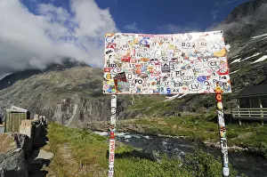 With transfer pictures pasted place-name sign at the Trollstigen