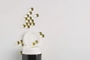 Transparent capsules spilled out of a jar