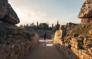 A traveler strolls through the ancient Roman theatre in Merida