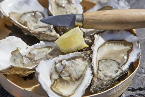 Wonderful Europe! - Culinary Diversity Prints: Tray with oysters, lemon and oyster knife at a street fair