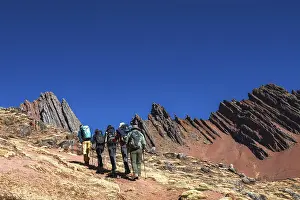 Framed Print : Trekking group in front of bizarre rock formations near Huampococha