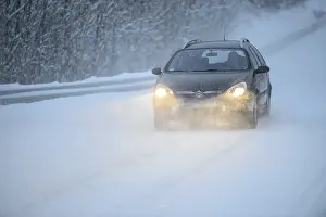 Truck driving on snowy road, winter driving