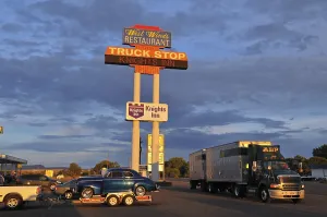 Truck stop with truck and classic car