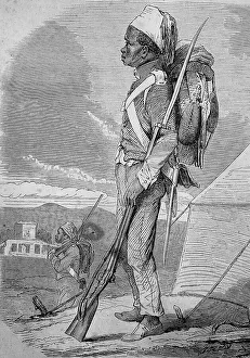 A Tunisian soldier with a backpack and a musket