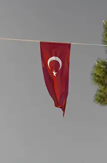 Turkish national flags with white star and moon in sky