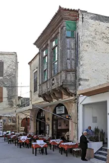 Turkish wooden oriel windows on a house facade in Rethymno