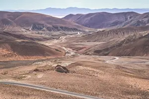 Twisting road from the high plateau to Quebrada de Humahuaca mountains in northern Argentina