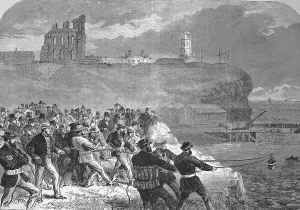 The Tynemouth brigade of volunteer rescue workers practising manoeuvring the rescue gondola