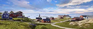 Typical architecture of Greenland Ilulissat with colored houses located near fjords and icebergs