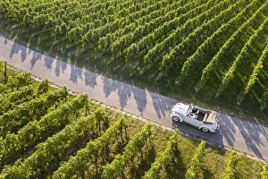 UAV recording, businessman in a vintage car