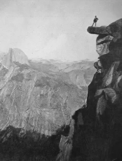 United States of America, Man standing on a rocky outcrop