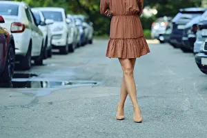 Unrecognizable woman is walking down a city street
