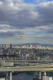 Framed Print : Urban panorama with visible highways and mountains on the horizon under a cloud cover