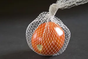 Vegetables, tomato lycopersicum esculeutum or solanum lycopersicum in nylon net on black background 21-May-2010