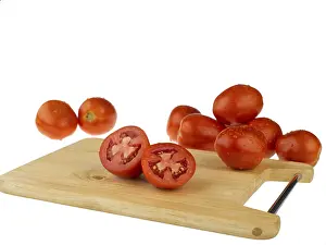 Vegetables, tomatoes with cutting board on white background