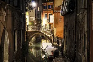Venice Canal scene with a small bridge at night