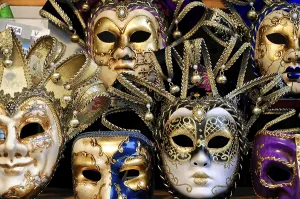 Venice, Veneto, Italy, Europe, Elaborate golden Venetian carnival masks with ornaments and decorations
