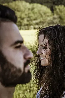 Vertical close up portrait of a couple laughing